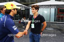(L to R): Felipe Nasr (BRA) Sauber with Pedro Piquet (BRA) Racing Driver and son of Nelson Piquet (BRA). 14.11.2015. Formula 1 World Championship, Rd 18, Brazilian Grand Prix, Sao Paulo, Brazil, Qualifying Day.
