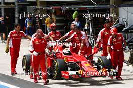Sebastian Vettel (GER) Ferrari SF15-T in the pits. 14.11.2015. Formula 1 World Championship, Rd 18, Brazilian Grand Prix, Sao Paulo, Brazil, Qualifying Day.