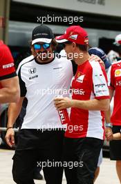 (L to R): Fernando Alonso (ESP) McLaren with Sebastian Vettel (GER) Ferrari on the drivers parade. 15.11.2015. Formula 1 World Championship, Rd 18, Brazilian Grand Prix, Sao Paulo, Brazil, Race Day.