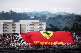 Ferrari fans with a large flag. 15.11.2015. Formula 1 World Championship, Rd 18, Brazilian Grand Prix, Sao Paulo, Brazil, Race Day.