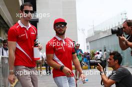 (L to R): Alexander Rossi (USA) Manor Marussia F1 Team with team mate Will Stevens (GBR) Manor Marussia F1 Team. 15.11.2015. Formula 1 World Championship, Rd 18, Brazilian Grand Prix, Sao Paulo, Brazil, Race Day.