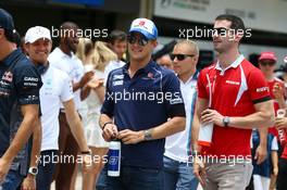 (L to R): Marcus Ericsson (SWE) Sauber F1 Team with Alexander Rossi (USA) Manor Marussia F1 Team on the drivers parade. 15.11.2015. Formula 1 World Championship, Rd 18, Brazilian Grand Prix, Sao Paulo, Brazil, Race Day.