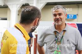 (L to R): Cyril Abiteboul (FRA) Renault Sport F1 Managing Director with Dieter Gass (GER) Audi Sport Head of DTM. 15.11.2015. Formula 1 World Championship, Rd 18, Brazilian Grand Prix, Sao Paulo, Brazil, Race Day.