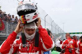 Sebastian Vettel (GER) Ferrari on the grid. 07.06.2015. Formula 1 World Championship, Rd 7, Canadian Grand Prix, Montreal, Canada, Race Day.