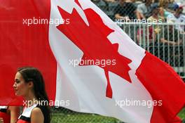 Grid girl with the Canadian flag. 07.06.2015. Formula 1 World Championship, Rd 7, Canadian Grand Prix, Montreal, Canada, Race Day.