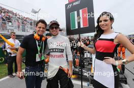 (L to R): Javier Hernandez (MEX) Manchester Utd Football Player with Sergio Perez (MEX) Sahara Force India F1 on the grid. 07.06.2015. Formula 1 World Championship, Rd 7, Canadian Grand Prix, Montreal, Canada, Race Day.