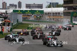 Lewis Hamilton (GBR) Mercedes AMG F1 W06 leads at the start of the race. 07.06.2015. Formula 1 World Championship, Rd 7, Canadian Grand Prix, Montreal, Canada, Race Day.