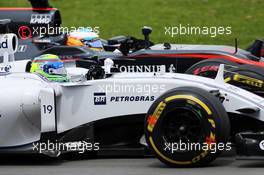 Felipe Massa (BRA) Williams FW37 and Fernando Alonso (ESP) McLaren MP4-30 battle for position. 07.06.2015. Formula 1 World Championship, Rd 7, Canadian Grand Prix, Montreal, Canada, Race Day.