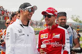 (L to R): Jenson Button (GBR) McLaren with Sebastian Vettel (GER) Ferrari on the drivers parade. 07.06.2015. Formula 1 World Championship, Rd 7, Canadian Grand Prix, Montreal, Canada, Race Day.