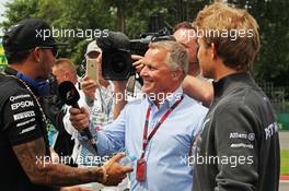 (L to R): Lewis Hamilton (GBR) Mercedes AMG F1 with Johnny Herbert (GBR) Sky Sports F1 Presenter and Nico Rosberg (GER) Mercedes AMG F1 on the drivers parade. 07.06.2015. Formula 1 World Championship, Rd 7, Canadian Grand Prix, Montreal, Canada, Race Day.