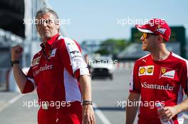 (L to R): Maurizio Arrivabene (ITA) Ferrari Team Principal with Sebastian Vettel (GER) Ferrari. 04.06.2015. Formula 1 World Championship, Rd 7, Canadian Grand Prix, Montreal, Canada, Preparation Day.