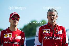 (L to R): Sebastian Vettel (GER) Ferrari with Maurizio Arrivabene (ITA) Ferrari Team Principal. 04.06.2015. Formula 1 World Championship, Rd 7, Canadian Grand Prix, Montreal, Canada, Preparation Day.