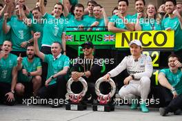 Race winner Lewis Hamilton (GBR) Mercedes AMG F1 and second placed Nico Rosberg (GER) Mercedes AMG F1 celebrate with the team. 12.04.2015. Formula 1 World Championship, Rd 3, Chinese Grand Prix, Shanghai, China, Race Day.