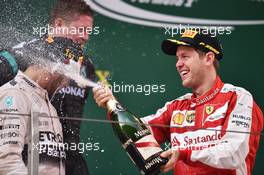 The podium (L to R): race winner Lewis Hamilton (GBR) Mercedes AMG F1 and third placed celebrate with the champagne. 12.04.2015. Formula 1 World Championship, Rd 3, Chinese Grand Prix, Shanghai, China, Race Day.