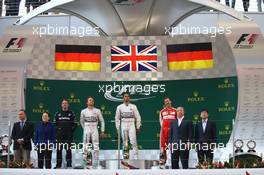 1st place Lewis Hamilton (GBR) Mercedes AMG F1, with 2nd place Nico Rosberg (GER) Mercedes AMG F1 and 3rd place Sebastian Vettel (GER) Ferrari. 12.04.2015. Formula 1 World Championship, Rd 3, Chinese Grand Prix, Shanghai, China, Race Day.