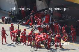 Sebastian Vettel (GER) Ferrari SF15-T makes a pit stop. 12.04.2015. Formula 1 World Championship, Rd 3, Chinese Grand Prix, Shanghai, China, Race Day.