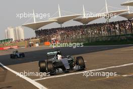 Lewis Hamilton (GBR) Mercedes AMG F1 W06 celebrates as he takes the chequered flag at the end of the race. 12.04.2015. Formula 1 World Championship, Rd 3, Chinese Grand Prix, Shanghai, China, Race Day.