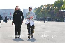 Pastor Maldonado (VEN) Lotus F1 Team with Aurelie Donzelot (FRA) Lotus F1 Team Media Communications Manager. 11.04.2015. Formula 1 World Championship, Rd 3, Chinese Grand Prix, Shanghai, China, Qualifying Day.