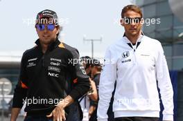 (L to R): Sergio Perez (MEX) Sahara Force India F1 with Jenson Button (GBR) McLaren. 12.04.2015. Formula 1 World Championship, Rd 3, Chinese Grand Prix, Shanghai, China, Race Day.
