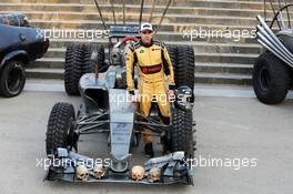 Pastor Maldonado (VEN) Lotus F1 Team with special race overalls and car livery to promote the film Mad Max: Fury Road. 08.05.2015. Formula 1 World Championship, Rd 5, Spanish Grand Prix, Barcelona, Spain, Practice Day.