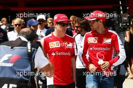 (L to R): Kimi Raikkonen (FIN) Ferrari with Sebastian Vettel (GER) Ferrari on the drivers parade. 10.05.2015. Formula 1 World Championship, Rd 5, Spanish Grand Prix, Barcelona, Spain, Race Day.