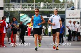 Jenson Button (GBR) McLaren runs in the paddock with Mike Collier (GBR) Personal Trainer of Jenson Button (GBR) McLaren. 07.05.2015. Formula 1 World Championship, Rd 5, Spanish Grand Prix, Barcelona, Spain, Preparation Day.