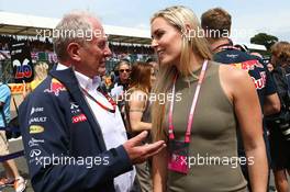(L to R): Dr Helmut Marko (AUT) Red Bull Motorsport Consultant with Lindsey Vonn (USA) Alpine Ski Racer on the grid. 05.07.2015. Formula 1 World Championship, Rd 9, British Grand Prix, Silverstone, England, Race Day.