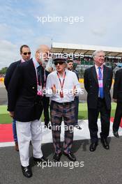 (L to R): HRH Prince Michael of Kent (GBR) with Jackie Stewart (GBR) and Michael Fallon MP (GBR) Defence Secretary  on the grid. 05.07.2015. Formula 1 World Championship, Rd 9, British Grand Prix, Silverstone, England, Race Day.