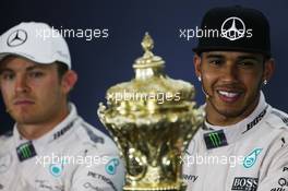 Race winner Lewis Hamilton (GBR) Mercedes AMG F1 in the FIA Press Conference with his race trophy and team mate Nico Rosberg (GER) Mercedes AMG F1. 05.07.2015. Formula 1 World Championship, Rd 9, British Grand Prix, Silverstone, England, Race Day.