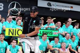 Race winner Lewis Hamilton (GBR) Mercedes AMG F1 celebrates with the team. 05.07.2015. Formula 1 World Championship, Rd 9, British Grand Prix, Silverstone, England, Race Day.