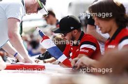 Will Stevens (GBR) Manor Marussia F1 Team and Roberto Merhi (ESP) Manor Marussia F1 Team sign autographs for the fans. 04.07.2015. Formula 1 World Championship, Rd 9, British Grand Prix, Silverstone, England, Qualifying Day.