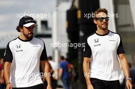 (L to R): Fernando Alonso (ESP) McLaren with Jenson Button (GBR) McLaren. 04.07.2015. Formula 1 World Championship, Rd 9, British Grand Prix, Silverstone, England, Qualifying Day.