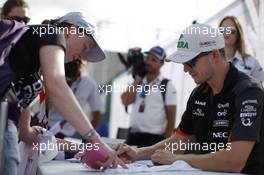 Nico Hulkenberg (GER) Sahara Force India F1 signs autographs for the fans. 04.07.2015. Formula 1 World Championship, Rd 9, British Grand Prix, Silverstone, England, Qualifying Day.