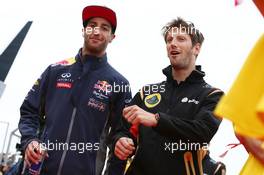 (L to R): Daniel Ricciardo (AUS) Red Bull Racing with Romain Grosjean (FRA) Lotus F1 Team on the drivers parade. 05.07.2015. Formula 1 World Championship, Rd 9, British Grand Prix, Silverstone, England, Race Day.