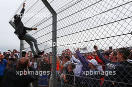 Lewis Hamilton (GBR) Mercedes AMG F1 climbs hte fence to greet the fans. 05.07.2015. Formula 1 World Championship, Rd 9, British Grand Prix, Silverstone, England, Race Day.