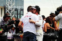 Fernando Alonso (ESP) McLaren with Tom Bianchi (FRA) on the grid. 26.07.2015. Formula 1 World Championship, Rd 10, Hungarian Grand Prix, Budapest, Hungary, Race Day.