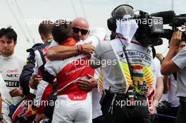 Philippe Bianchi (ITA), the father of Jules Bianchi, with Will Stevens (GBR) Manor Marussia F1 Team on the grid. 26.07.2015. Formula 1 World Championship, Rd 10, Hungarian Grand Prix, Budapest, Hungary, Race Day.