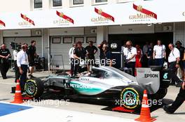 Lewis Hamilton (GBR) Mercedes AMG F1 W06 is pushed onto the weighbridge in the pits. 25.07.2015. Formula 1 World Championship, Rd 10, Hungarian Grand Prix, Budapest, Hungary, Qualifying Day.