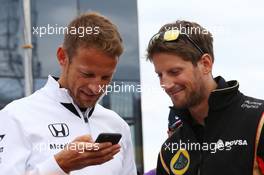 (L to R): Jenson Button (GBR) McLaren with Romain Grosjean (FRA) Lotus F1 Team on the drivers parade. 26.07.2015. Formula 1 World Championship, Rd 10, Hungarian Grand Prix, Budapest, Hungary, Race Day.