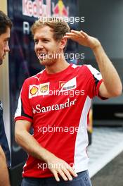 Sebastian Vettel (GER) Ferrari with Guillaume Rocquelin (ITA) Red Bull Racing Head of Race Engineering. 26.07.2015. Formula 1 World Championship, Rd 10, Hungarian Grand Prix, Budapest, Hungary, Race Day.