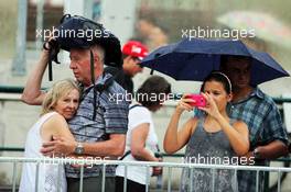 Fans in the pits during a rain storm. 23.07.2015. Formula 1 World Championship, Rd 10, Hungarian Grand Prix, Budapest, Hungary, Preparation Day.