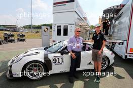 (L to R): Johnny Herbert (GBR) Sky Sports F1 Presenter and his Porsche Supercup car, with Nico Hulkenberg (GER) Sahara Force India F1. 23.07.2015. Formula 1 World Championship, Rd 10, Hungarian Grand Prix, Budapest, Hungary, Preparation Day.
