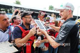 Nico Hulkenberg (GER) Sahara Force India F1 signs autographs for the fans. 03.09.2015. Formula 1 World Championship, Rd 12, Italian Grand Prix, Monza, Italy, Preparation Day.
