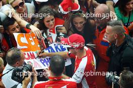 Sebastian Vettel (GER) Ferrari signs autographs for the fans. 03.09.2015. Formula 1 World Championship, Rd 12, Italian Grand Prix, Monza, Italy, Preparation Day.