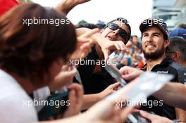 Sergio Perez (MEX) Sahara Force India F1 signs autographs for the fans. 03.09.2015. Formula 1 World Championship, Rd 12, Italian Grand Prix, Monza, Italy, Preparation Day.