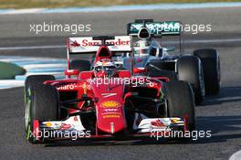 Kimi Raikkonen (FIN) Ferrari SF15-T leads Lewis Hamilton (GBR) Mercedes AMG F1 W06. 04.02.2015. Formula One Testing, Day Four, Jerez, Spain.