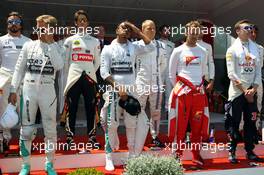 (L to R): Nico Rosberg (GER) Mercedes AMG F1; Lewis Hamilton (GBR) Mercedes AMG F1; Sebastian Vettel (GER) Ferrari; Daniil Kvyat (RUS) Red Bull Racing, as the grid observes the national anthem. 24.05.2015. Formula 1 World Championship, Rd 6, Monaco Grand Prix, Monte Carlo, Monaco, Race Day.