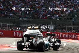 Nico Rosberg (GER) Mercedes AMG F1 W06 leads Lewis Hamilton (GBR) Mercedes AMG F1 W06 behind the FIA Safety Car. 01.11.2015. Formula 1 World Championship, Rd 17, Mexican Grand Prix, Mexixo City, Mexico, Race Day.