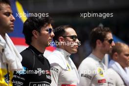 Sergio Perez (MEX) Sahara Force India F1 with the drivers as the grid observes the national anthem. 29.03.2015. Formula 1 World Championship, Rd 2, Malaysian Grand Prix, Sepang, Malaysia, Sunday.