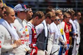 Sebastian Vettel (GER) Ferrari with the drivers as the grid observes the national anthem. 29.03.2015. Formula 1 World Championship, Rd 2, Malaysian Grand Prix, Sepang, Malaysia, Sunday.